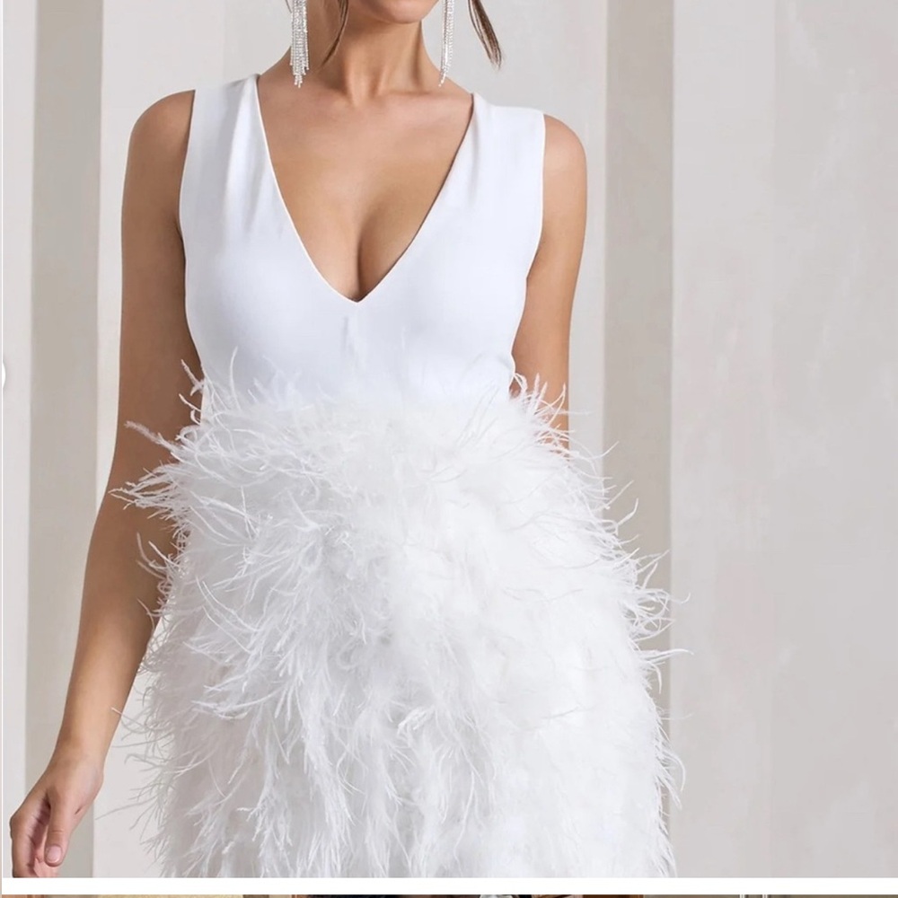 Club L white plunging Mini dress.